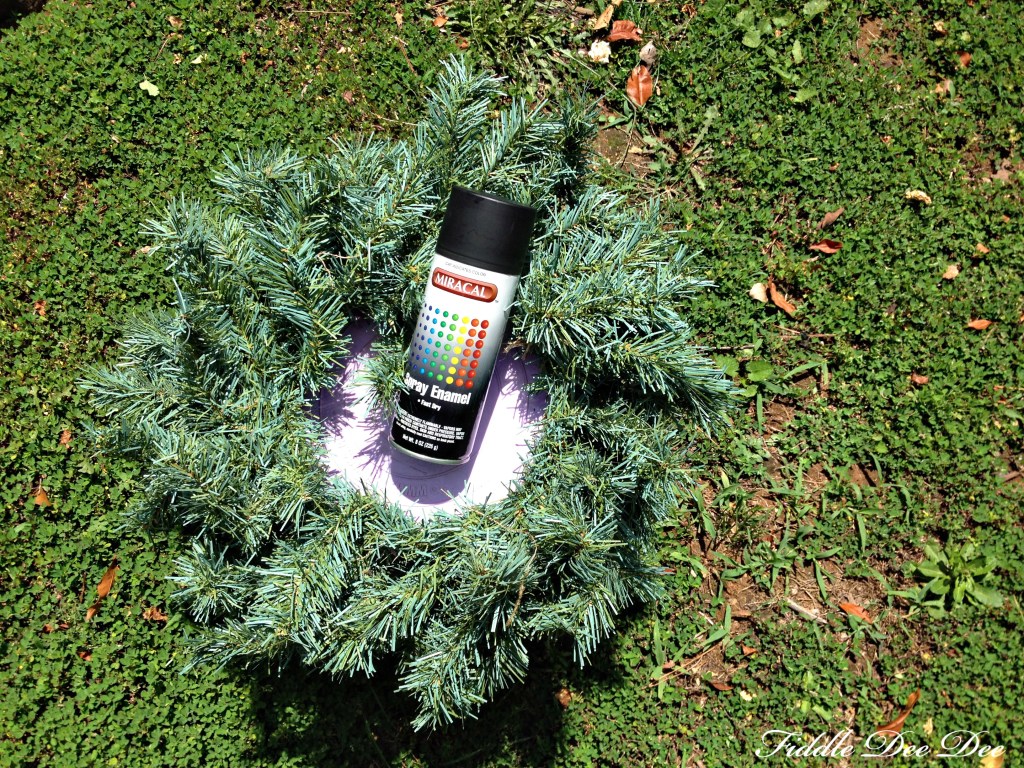 Dollar General spray paint works just fine to cover an old wreath for this project.