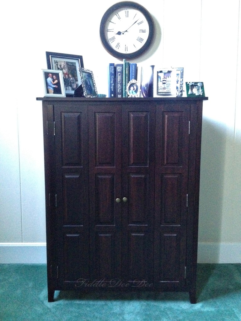 The dark entertainment cabinet that commands much attention in our living room