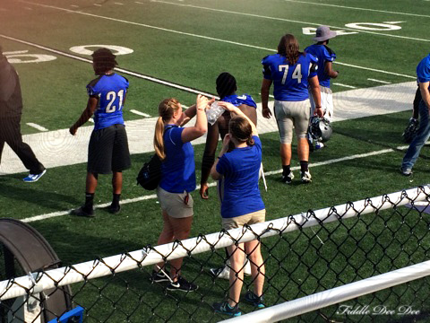 Helping treat an injured football player at the Faulkner game