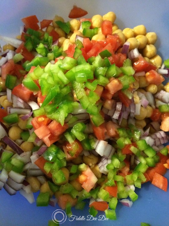 A cold chickpea (garbanzo bea) salad makes an awesome dish for a potluck; and festive as well