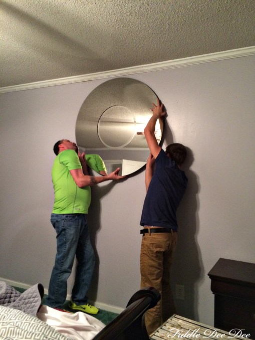 Audley and Bradley hanging the 75 pound mirror that I also found at Costco.