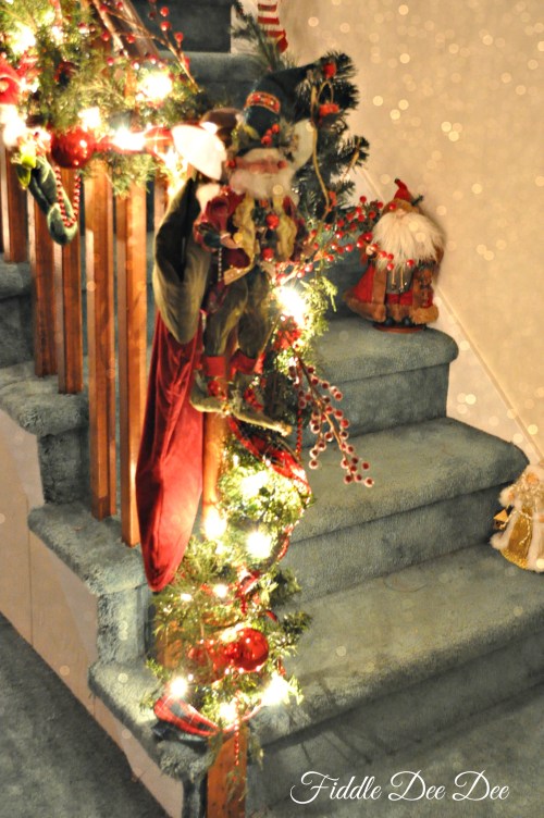 Tying in the banister to our tree with a Mark Roberts fairy